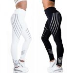 High-waisted black and white gym leggings with reflective silver stripe designs for private label fitness brands and bulk manufacturing.
