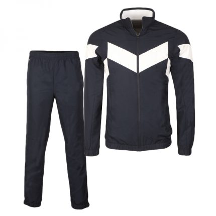 Professional navy blue tracksuit set with white chevron chest paneling, featuring a full-zip stand-collar jacket and matching elasticated trousers for B2B bulk manufacturing.