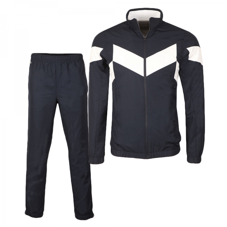 Custom Chevron Performance Tracksuit - Navy & White Professional navy blue tracksuit set with white chevron chest paneling, featuring a full-zip stand-collar jacket and matching elasticated trousers for B2B bulk manufacturing.