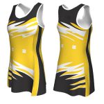 Women's netball dress featuring a yellow, black, and white lightning-bolt splash pattern for bulk B2B manufacturing.