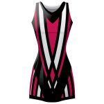 Women's sublimated netball dress featuring a magenta, black, and white sharp geometric V-pattern for bulk B2B manufacturing.