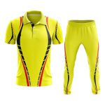 Custom yellow cricket uniform kit with black and red sublimated accents, featuring a button-down polo jersey and trousers for bespoke on-demand manufacturing.