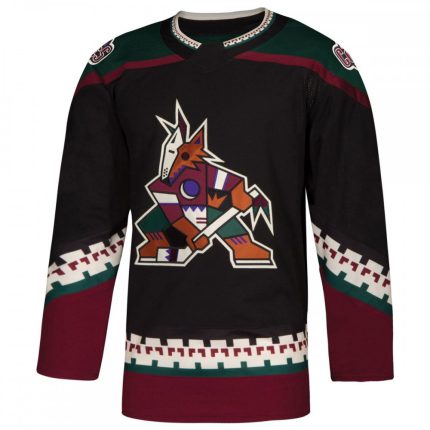 Professional black ice hockey jersey with maroon hem, kachina-style coyote logo, and geometric tribal patterns for bulk B2B manufacturing.