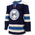 Professional navy blue ice hockey jersey with light blue and grey striped sleeves and a cannon chest logo for bulk B2B manufacturing.